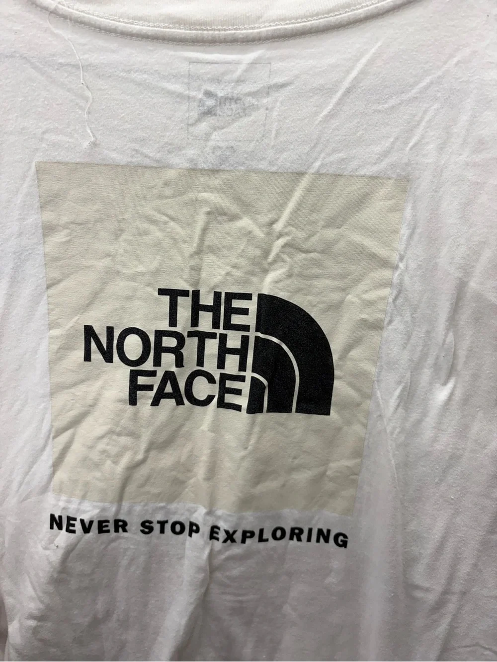 The North Face Men’s Cream Short-Sleeve Logo Tee with Black Chest Emblem